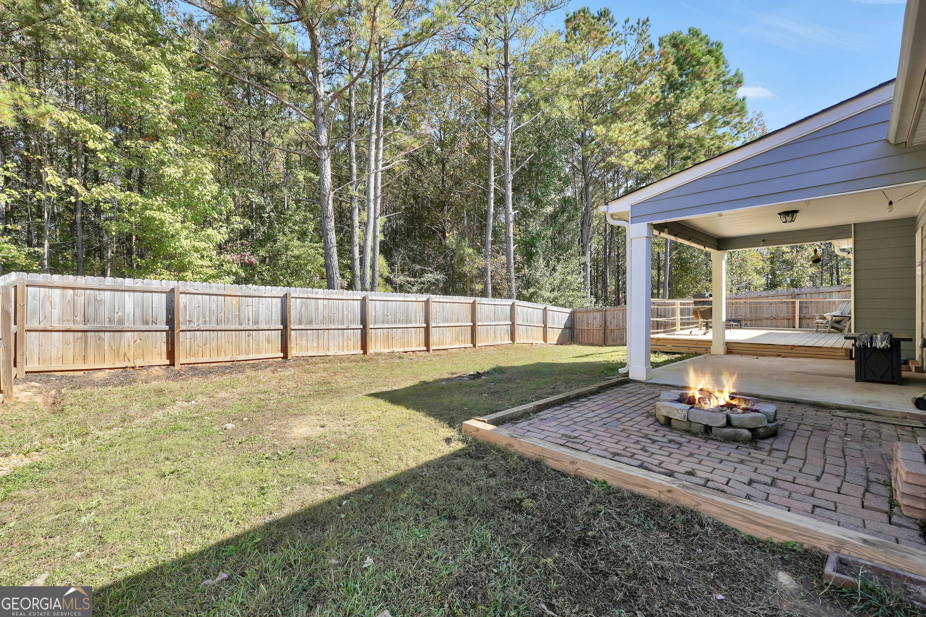 129 Magnolia Trail Milner, GA 30257 - Photo 25 of 29 a view of a backyard with large tree