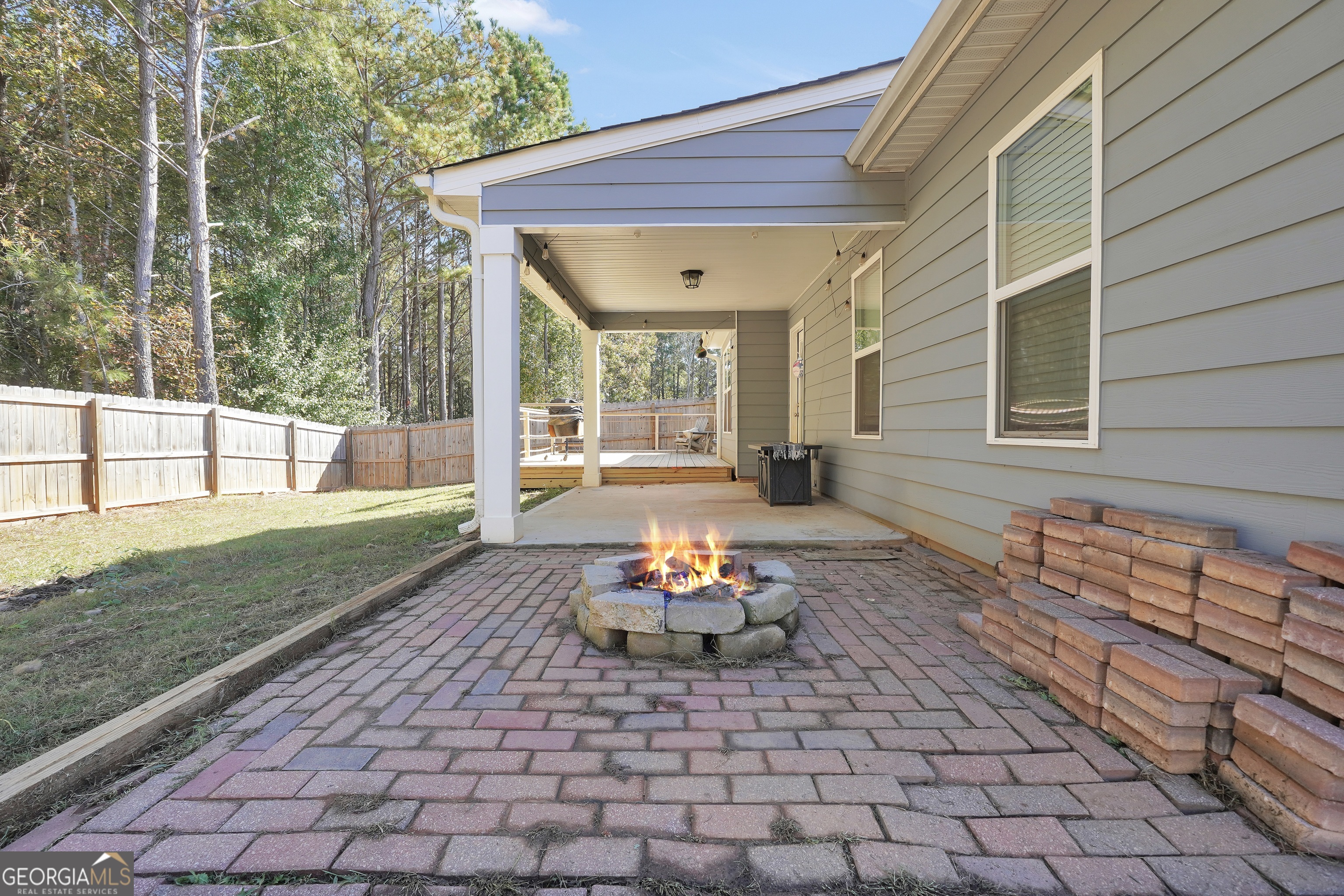 129 Magnolia Trail Milner, GA 30257 - Photo 27 of 29 a backyard of a house with outdoor seating