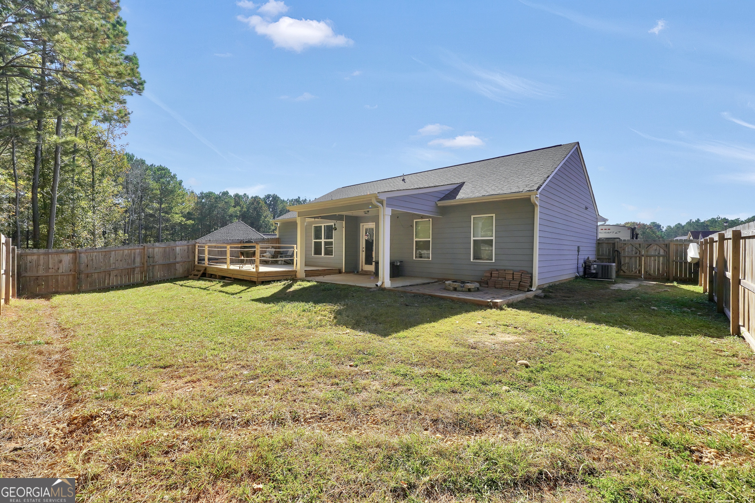 129 Magnolia Trail Milner, GA 30257 - Photo 28 of 29 a view of a house with backyard and sitting area
