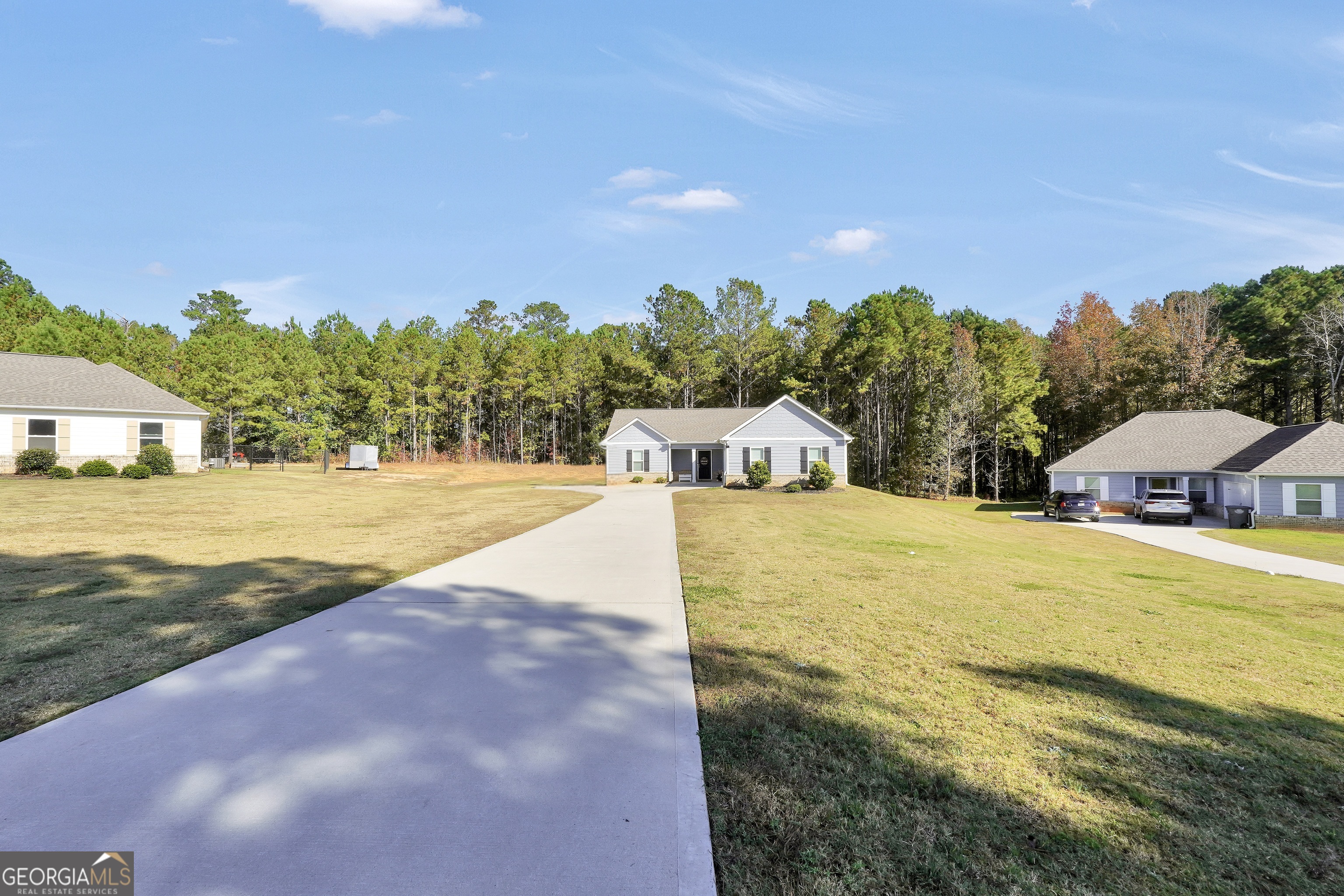129 Magnolia Trail Milner, GA 30257 - Photo 29 of 29 a view of an house with swimming pool and an outdoor space