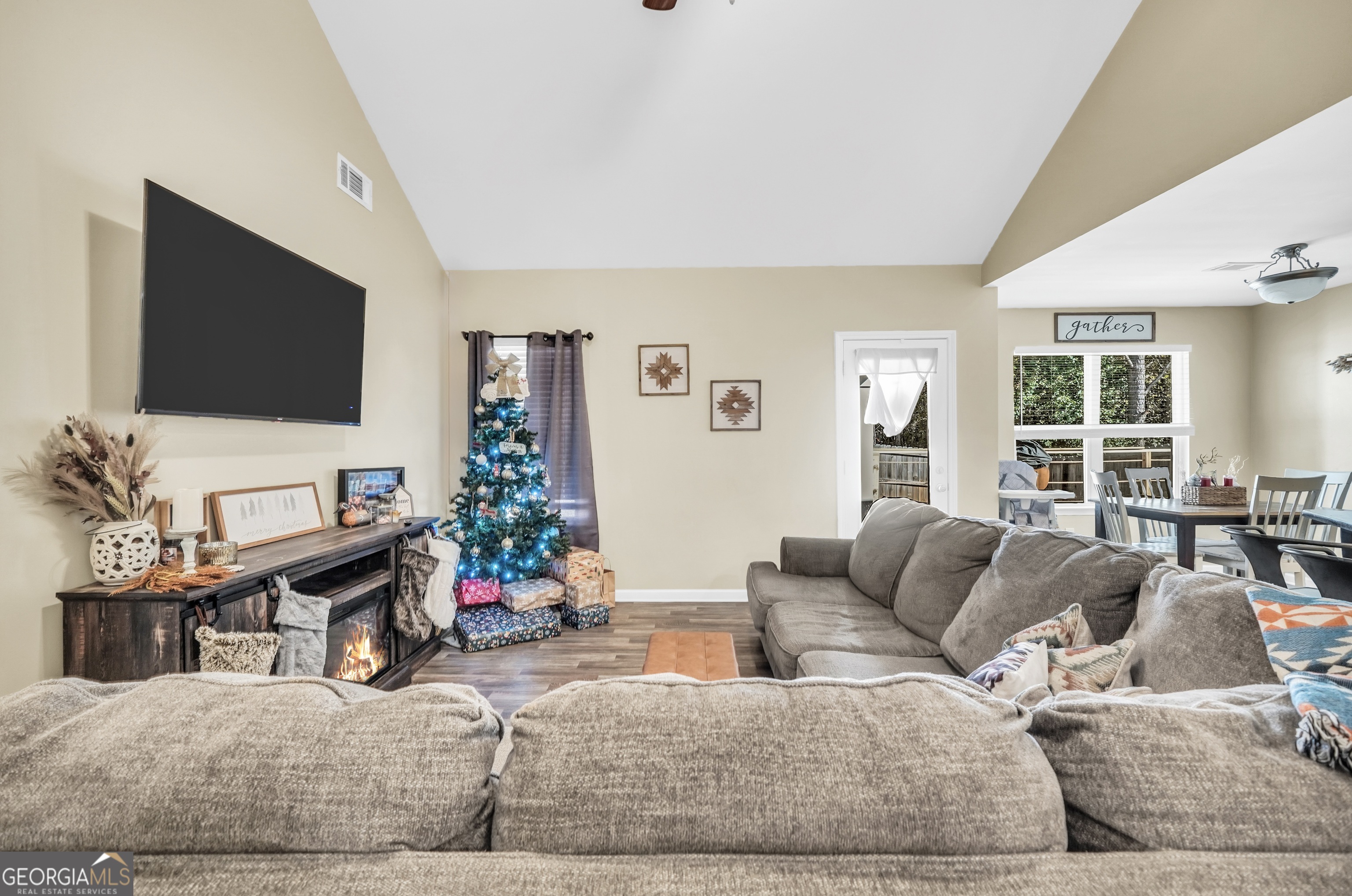 129 Magnolia Trail Milner, GA 30257 - Photo 6 of 29 a living room with furniture and a flat screen tv