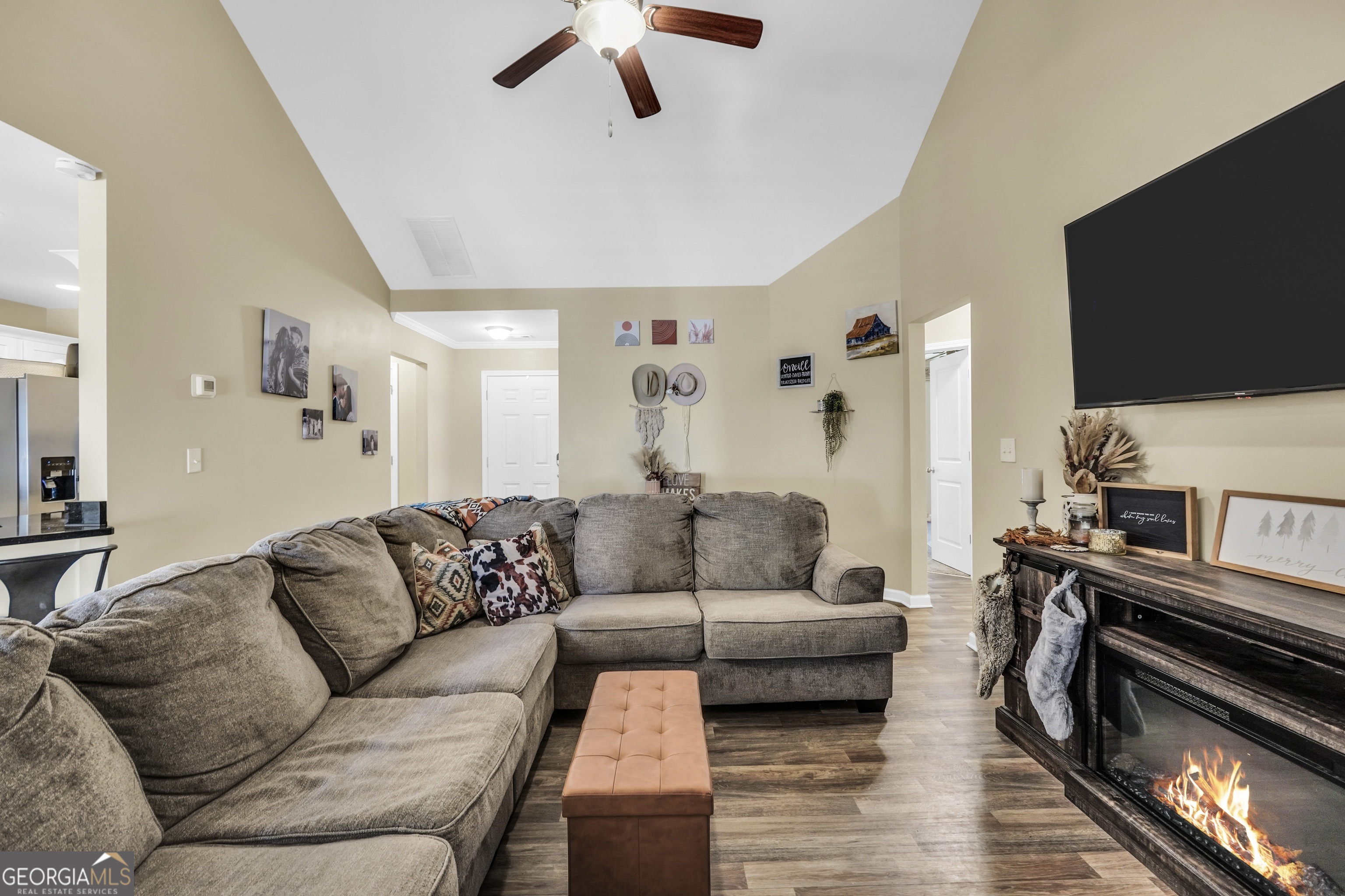 129 Magnolia Trail Milner, GA 30257 - Photo 7 of 29 a living room with furniture and a flat screen tv