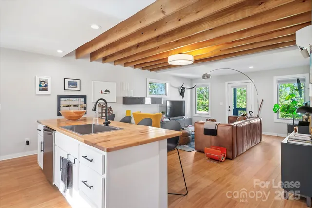 a view of living room with granite countertop furniture and fireplace
