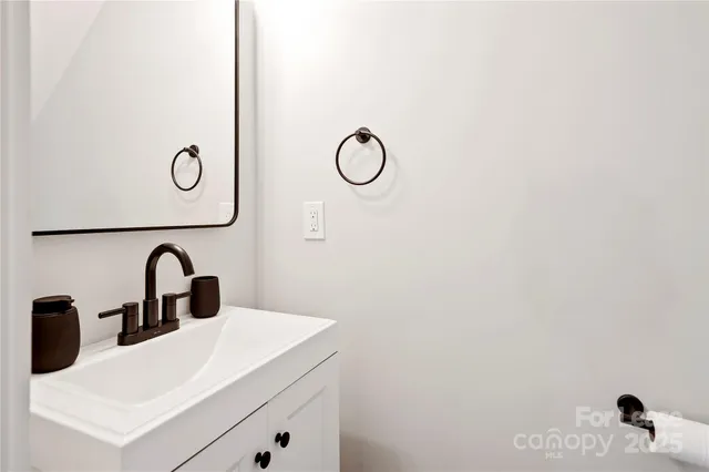 a close view of a sink and a mirror in a bathroom