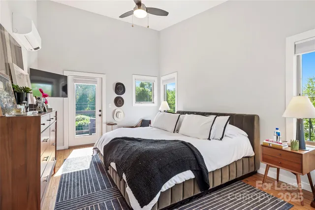 a bed room with a bed and a chandelier