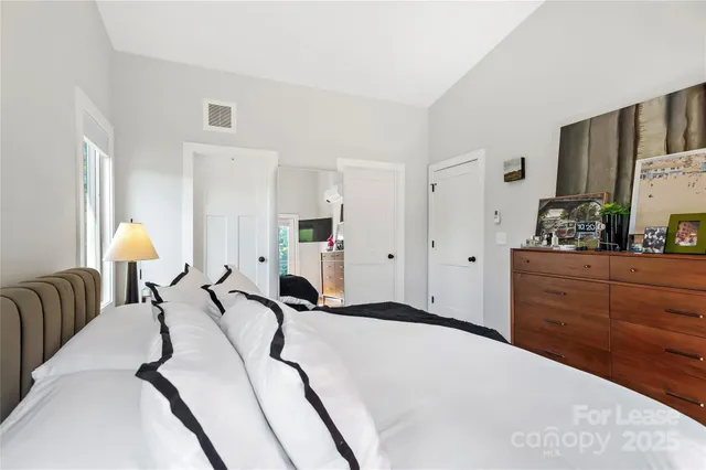 a bed room with a bed and a cabinets