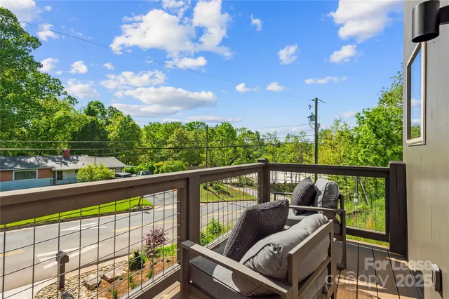 a view of roof deck with furniture