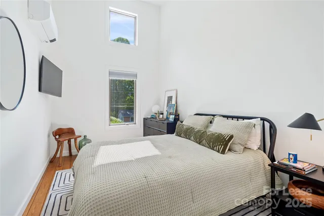 a bedroom with bed and a window