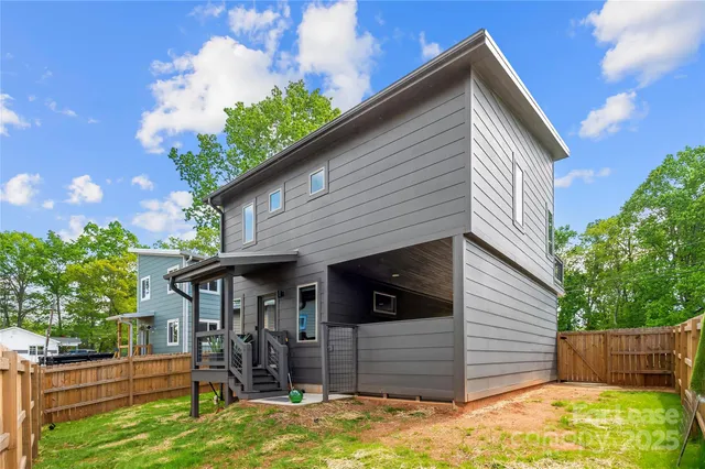 a view of house with backyard