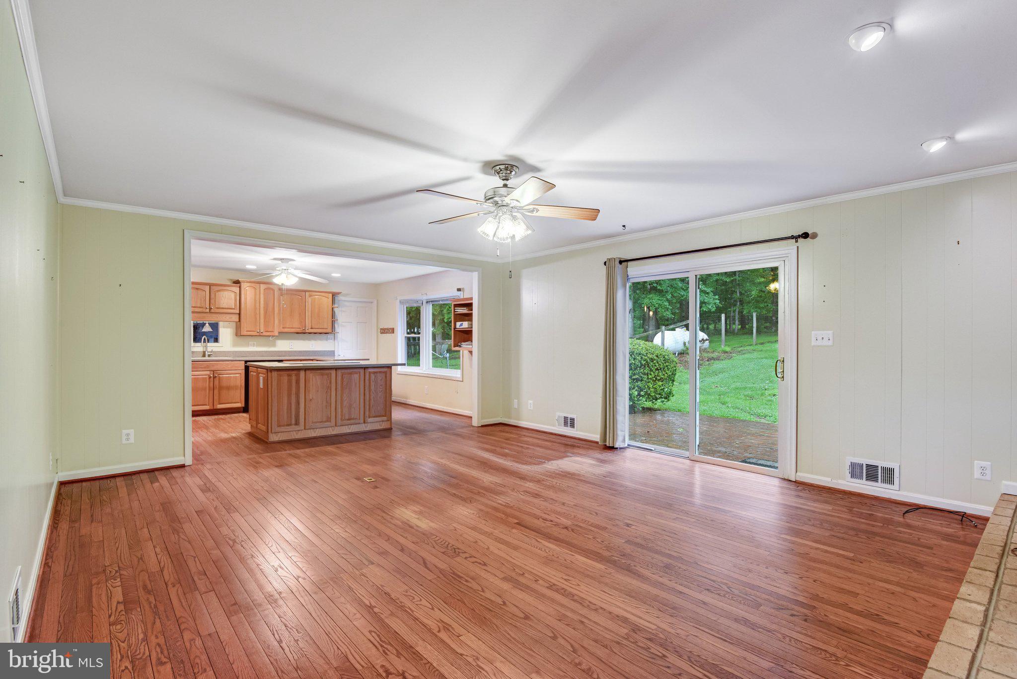7961 Leeds Manor Road Marshall, VA 20115 - Photo 10 of 40 a view of a kitchen with wooden floor and a window
