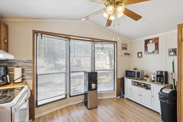 a kitchen with a refrigerator and a sink