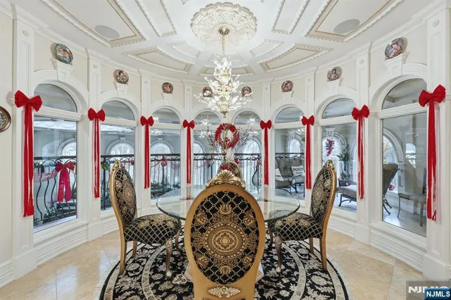 a view of a dining room with furniture chandelier