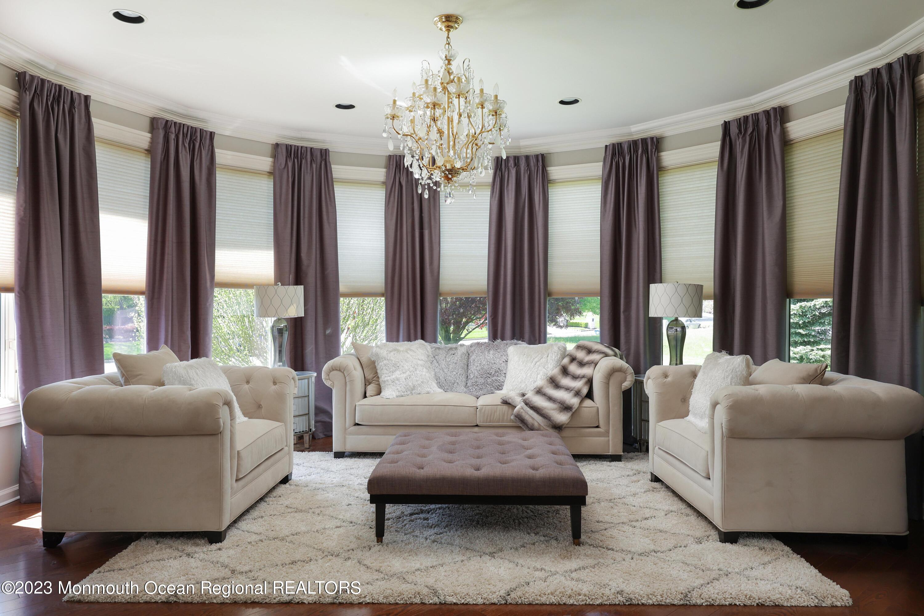 8 Old Stable Way Colts Neck, NJ 07722 - Photo 11 of 45 a living room with furniture and large windows