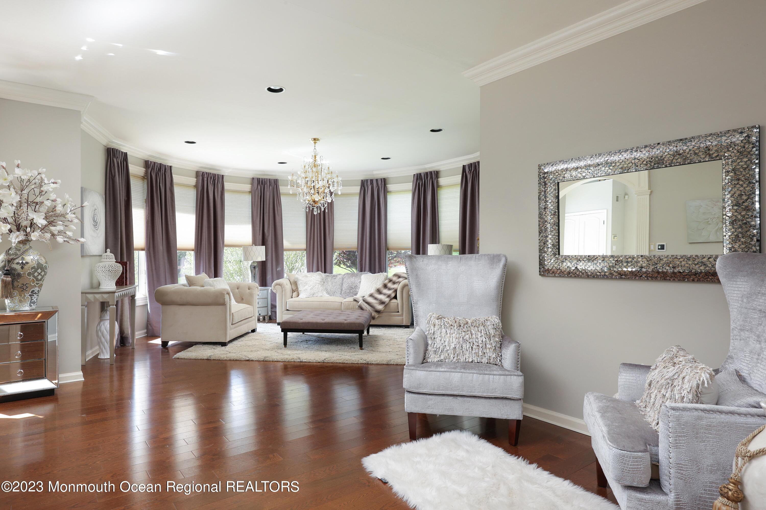 8 Old Stable Way Colts Neck, NJ 07722 - Photo 12 of 45 a living room with furniture and a large mirror