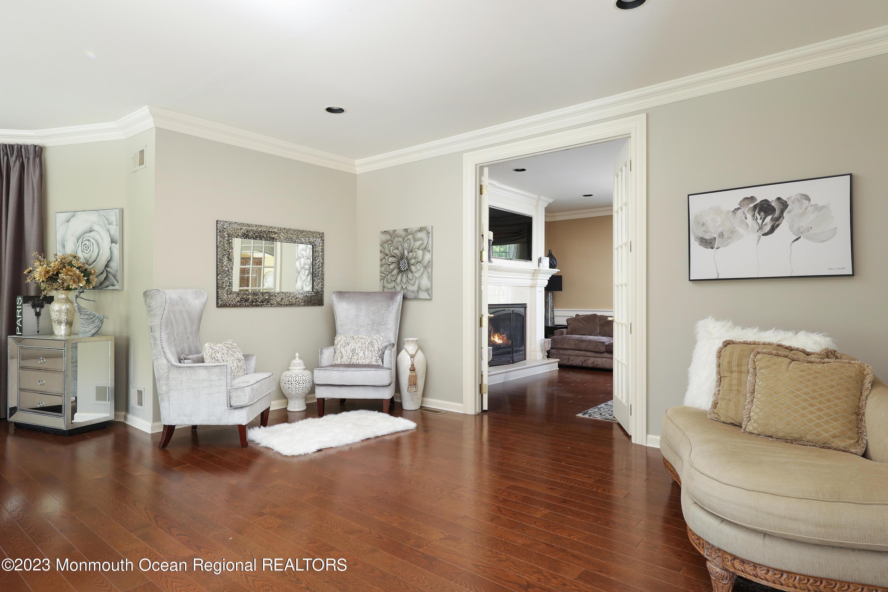 8 Old Stable Way Colts Neck, NJ 07722 - Photo 13 of 45 a living room with furniture and a wooden floor