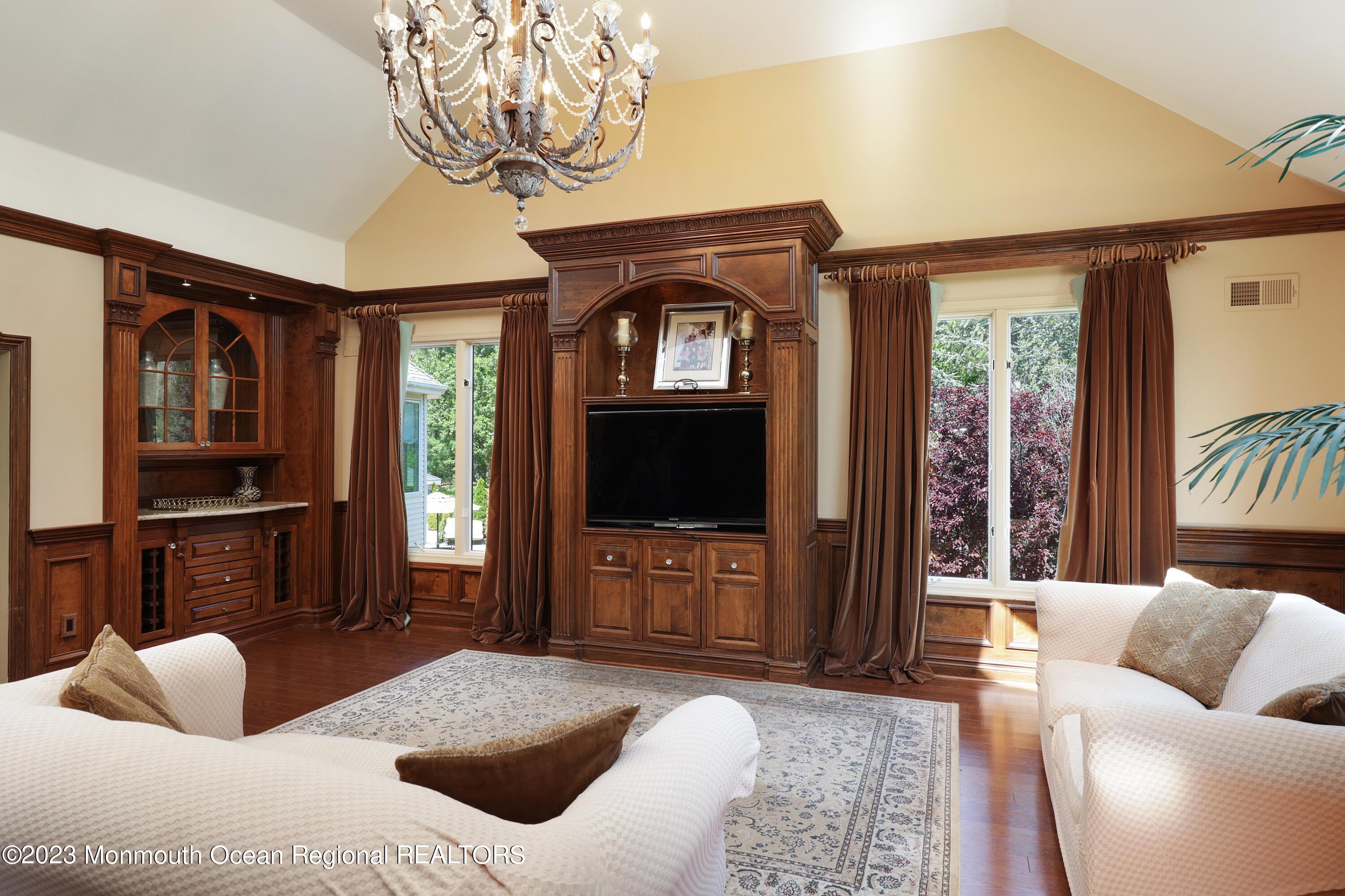 8 Old Stable Way Colts Neck, NJ 07722 - Photo 14 of 45 a bedroom with a bed and a television in it