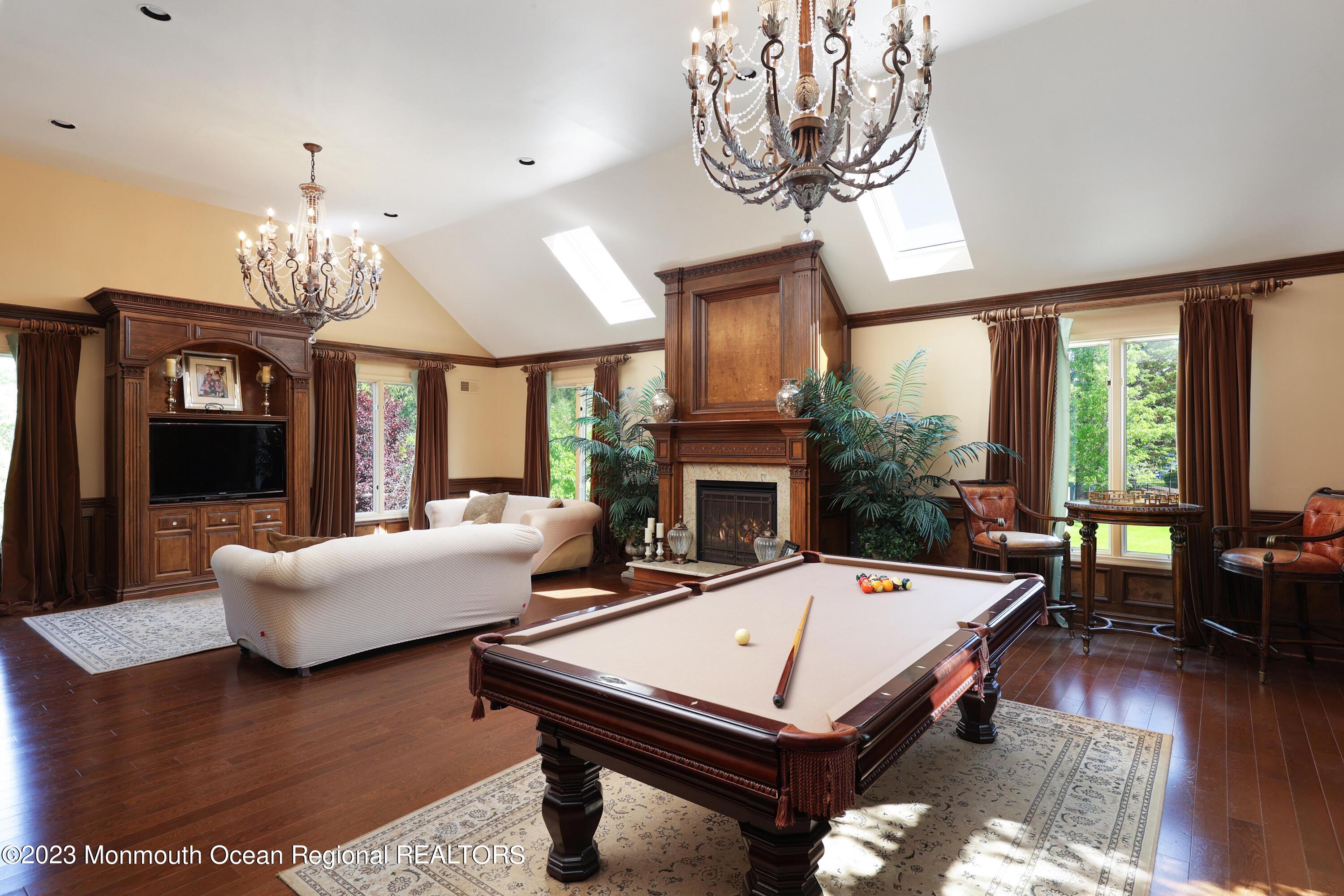 8 Old Stable Way Colts Neck, NJ 07722 - Photo 15 of 45 a living room with furniture a table and a large window