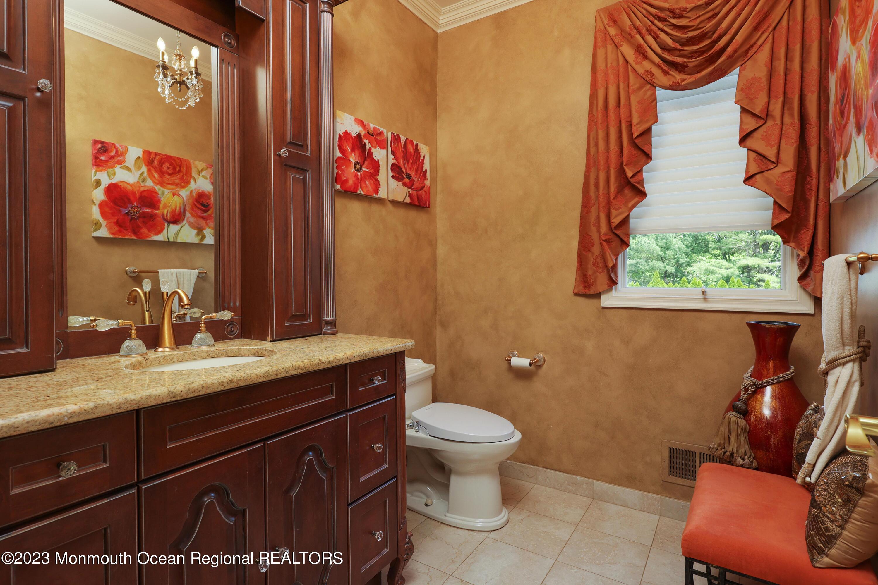 8 Old Stable Way Colts Neck, NJ 07722 - Photo 20 of 45 a bathroom with a toilet sink and mirror