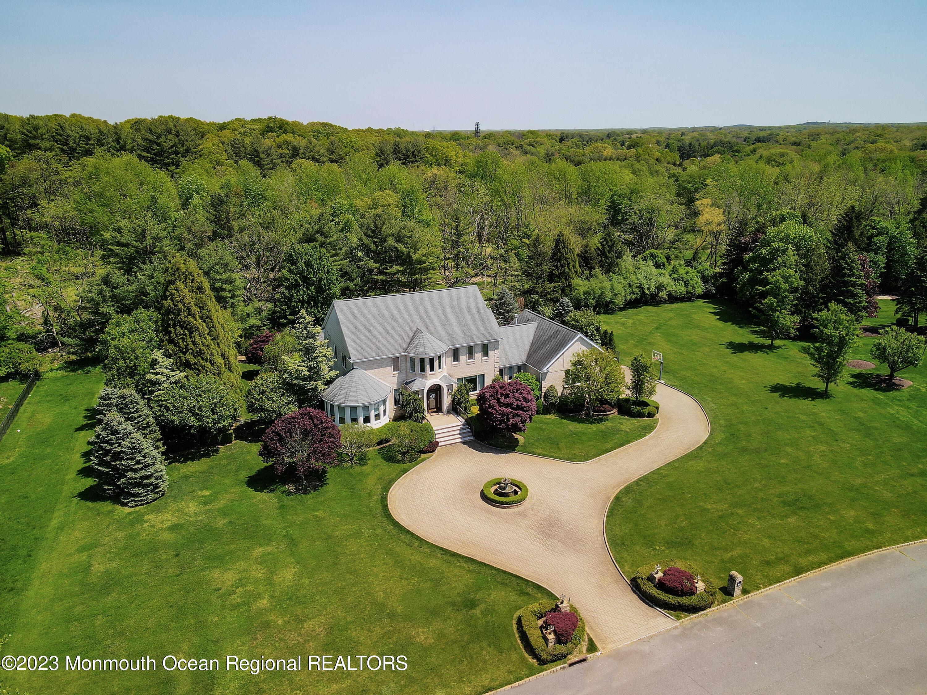 8 Old Stable Way Colts Neck, NJ 07722 - Photo 2 of 45 an aerial view of a house with a yard