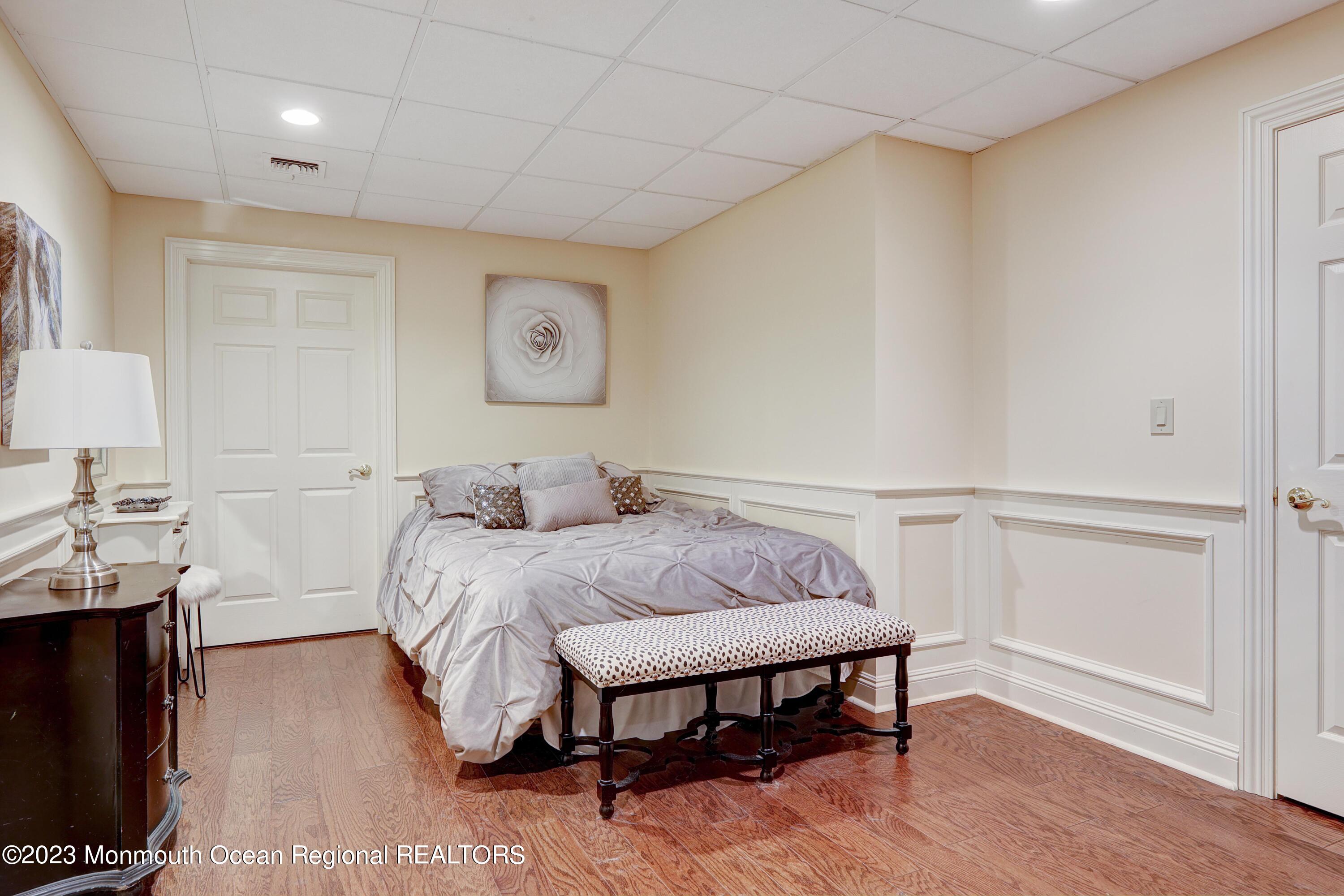 8 Old Stable Way Colts Neck, NJ 07722 - Photo 30 of 45 a spacious bedroom with a bed and a table