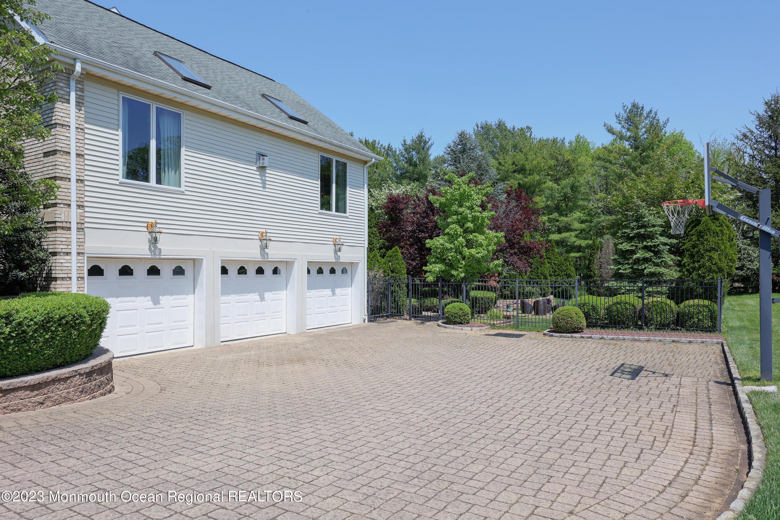 8 Old Stable Way Colts Neck, NJ 07722 - Photo 31 of 45 a view of a house with backyard and garden