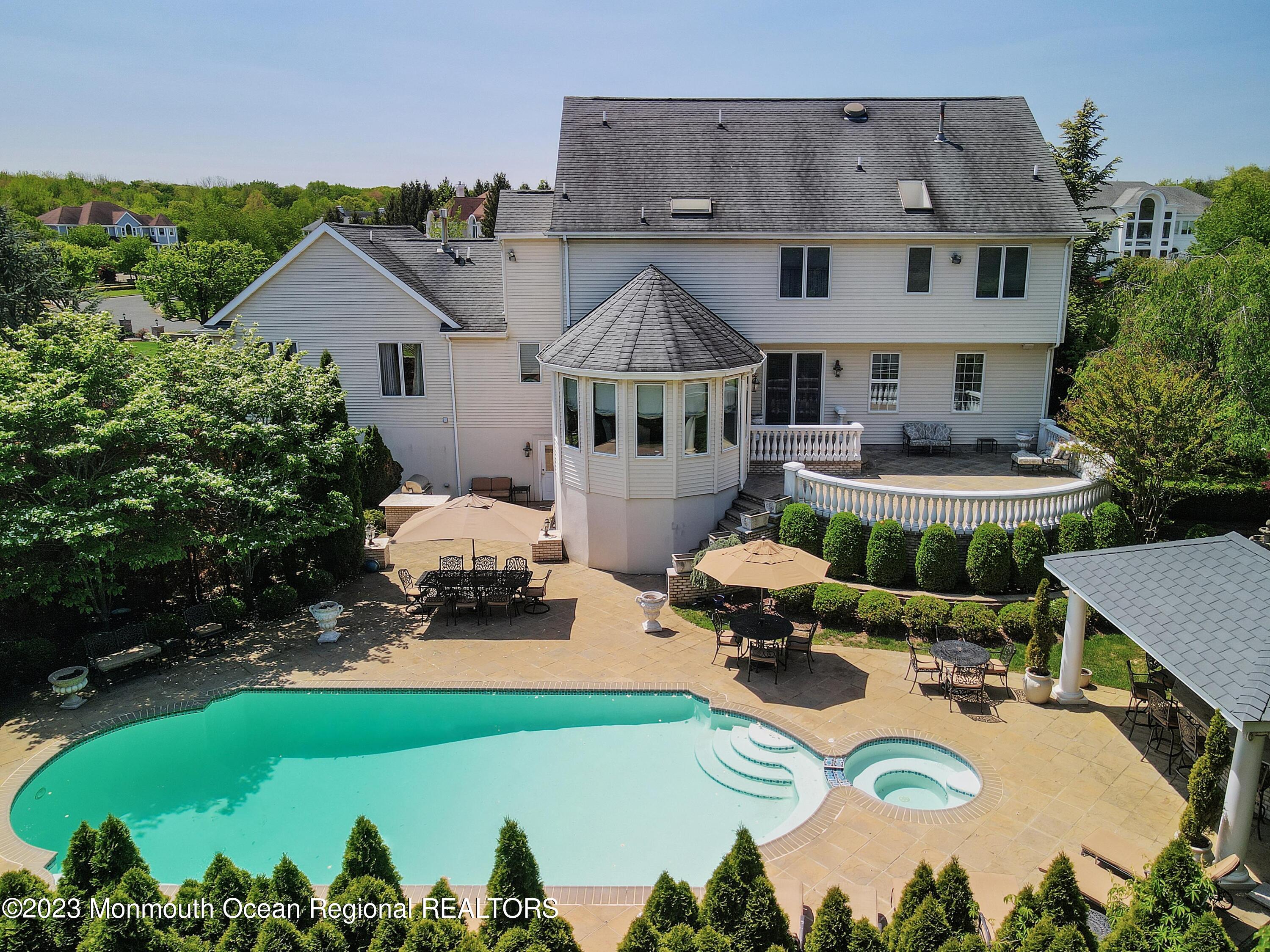 8 Old Stable Way Colts Neck, NJ 07722 - Photo 32 of 45 an aerial view of a house with swimming pool garden and patio