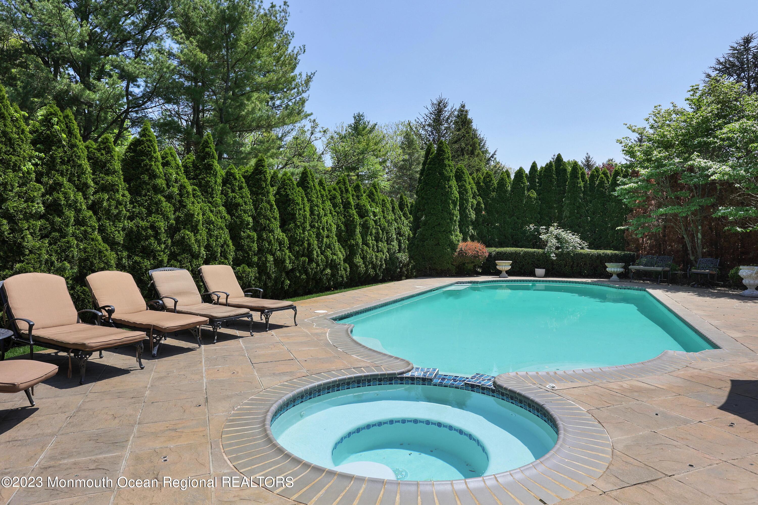 8 Old Stable Way Colts Neck, NJ 07722 - Photo 33 of 45 a view of outdoor space pool seating space