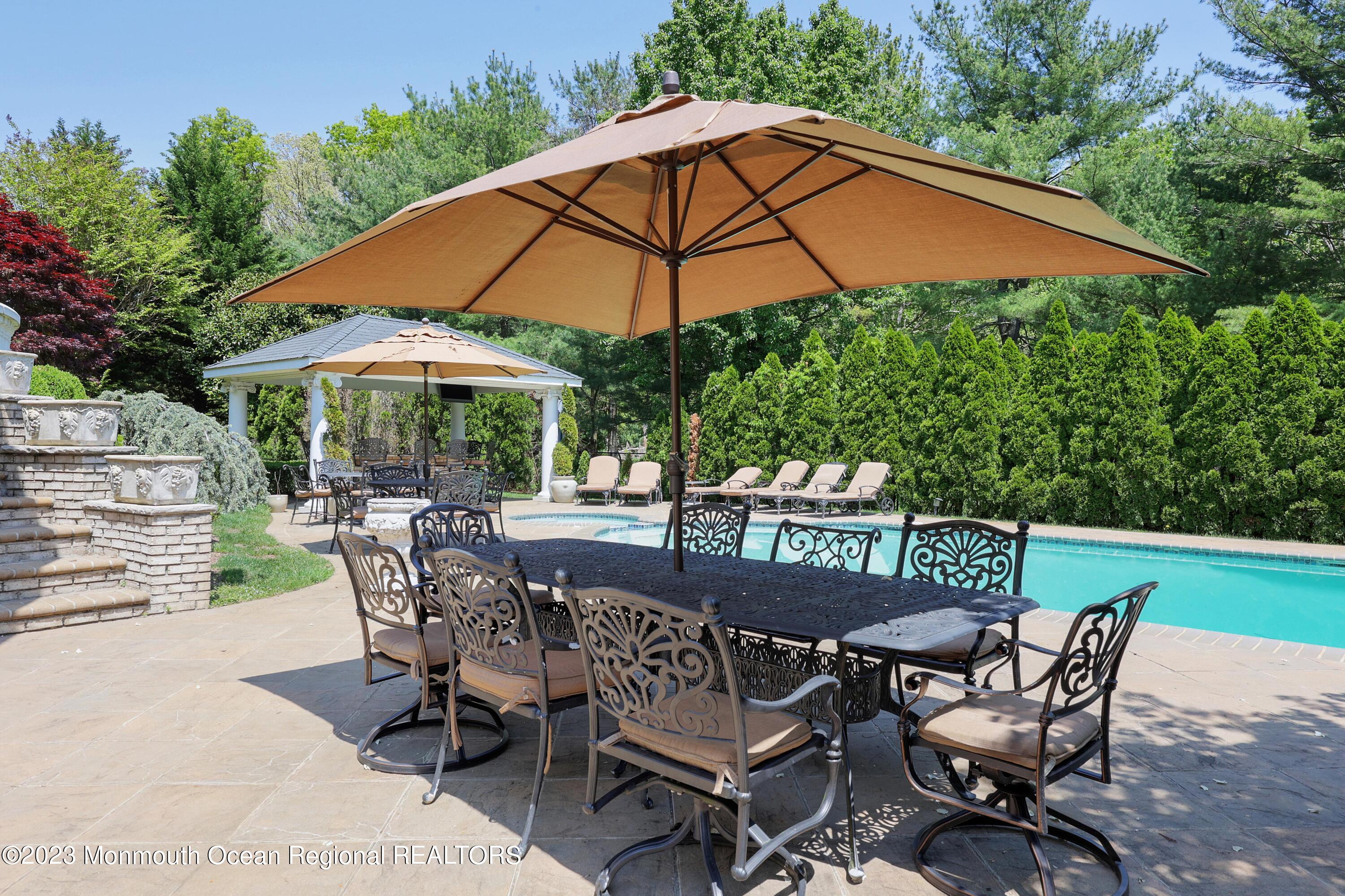 8 Old Stable Way Colts Neck, NJ 07722 - Photo 35 of 45 a view of a chair and table in the patio