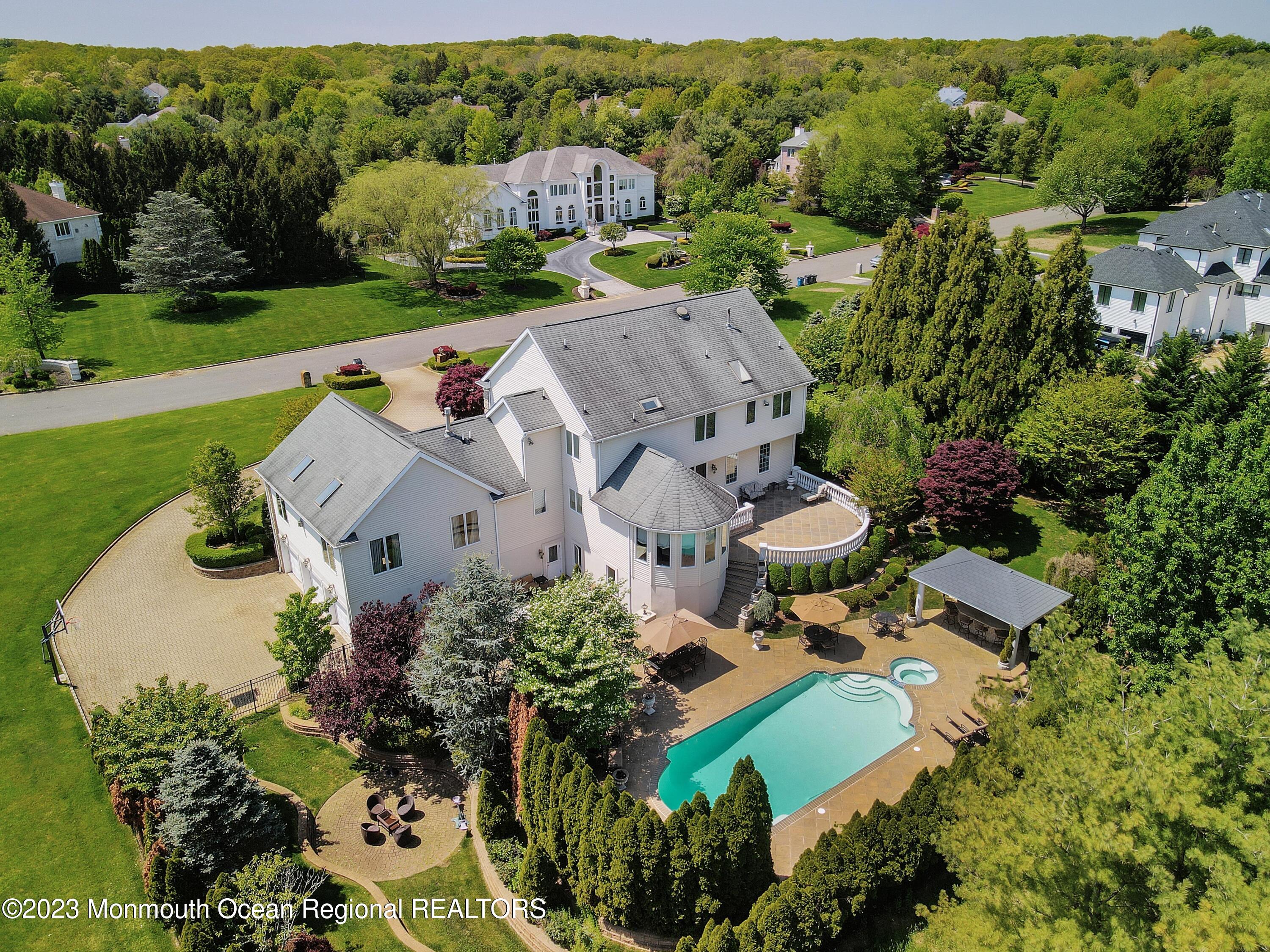 8 Old Stable Way Colts Neck, NJ 07722 - Photo 42 of 45 an aerial view of a house with a garden and lots of trees