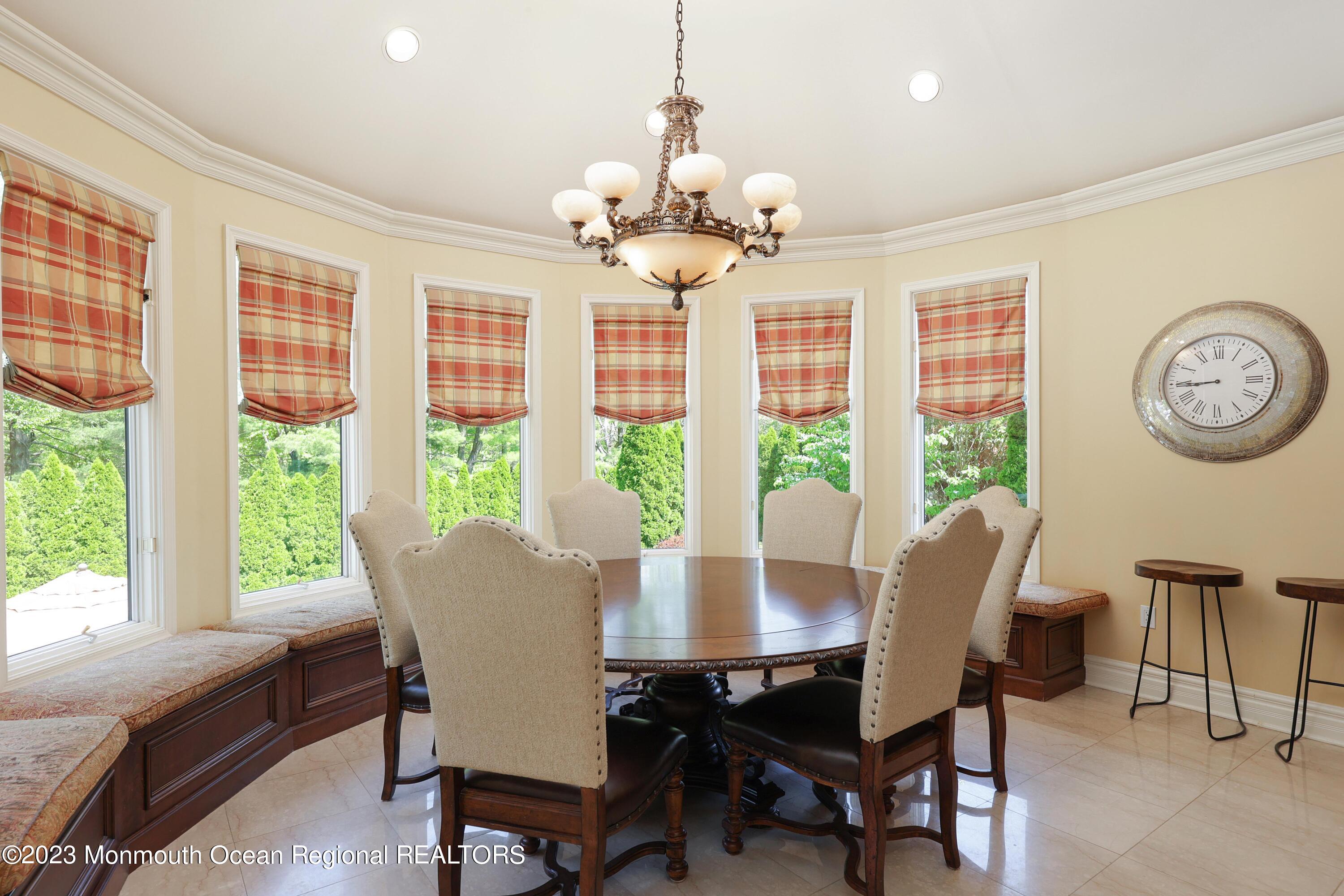 8 Old Stable Way Colts Neck, NJ 07722 - Photo 8 of 45 a view of a dining room with furniture window and outside view