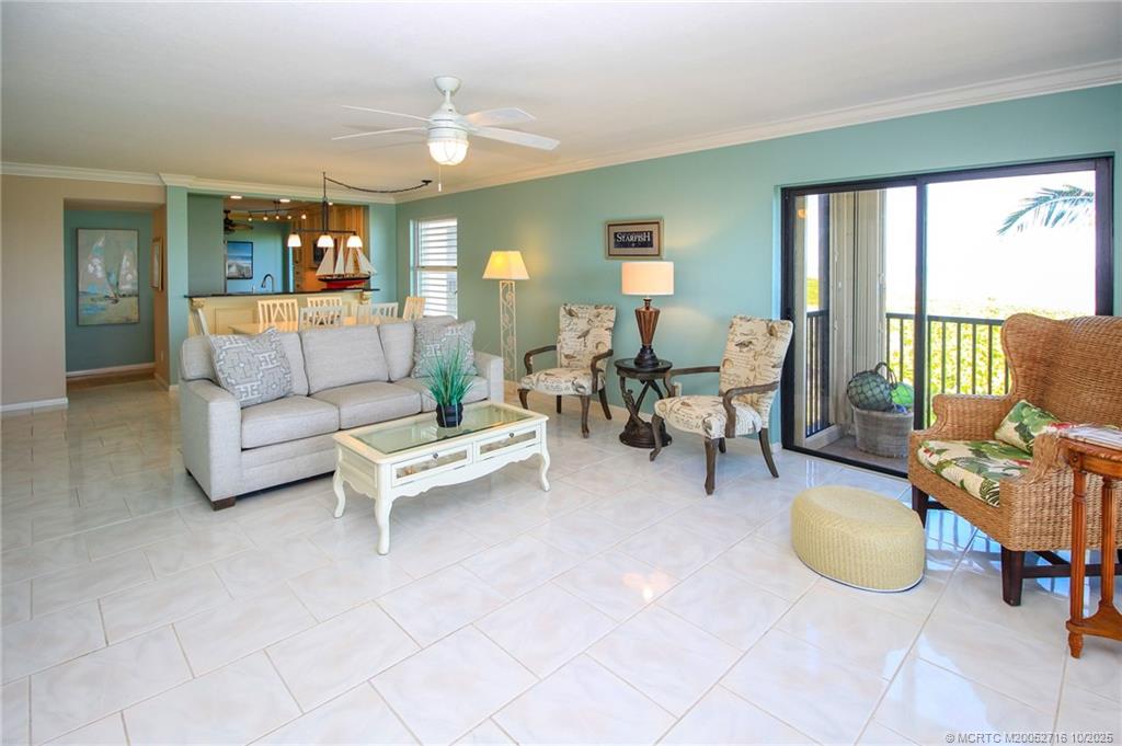 2571 Northeast Ocean Boulevard, Unit 10203 Stuart, FL 34996 - Photo 12 of 46 a living room with furniture and a fireplace