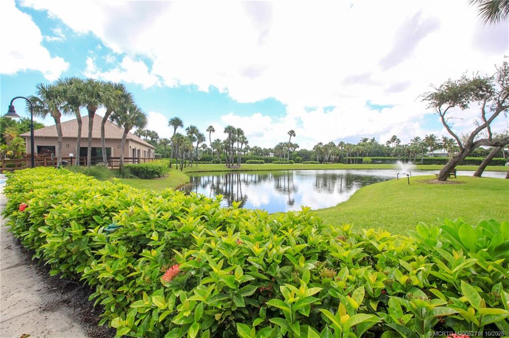2571 Northeast Ocean Boulevard, Unit 10203 Stuart, FL 34996 - Photo 40 of 46 a view of a lake with houses