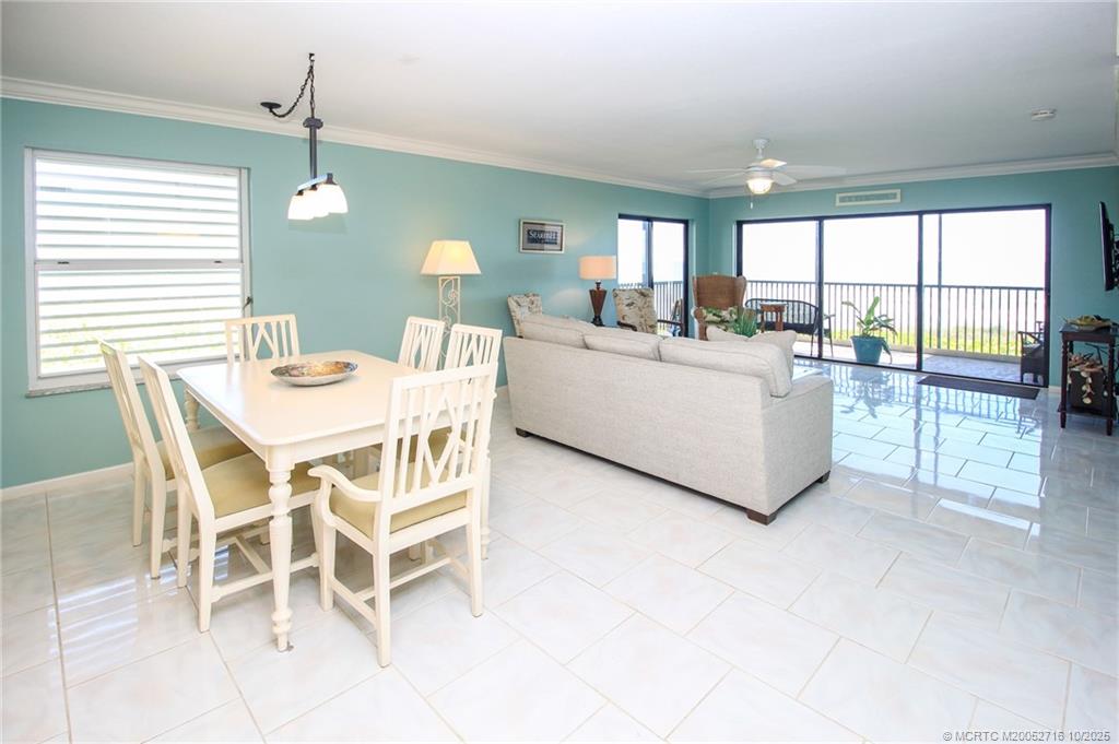 2571 Northeast Ocean Boulevard, Unit 10203 Stuart, FL 34996 - Photo 5 of 46 a view of a dining room with furniture window and outside view