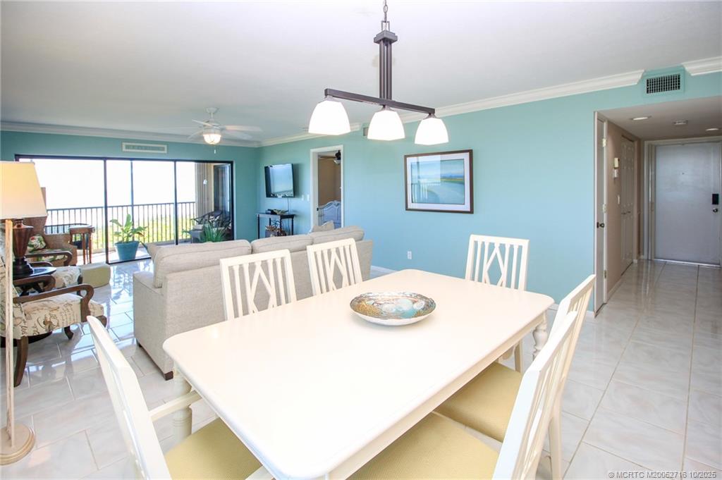 2571 Northeast Ocean Boulevard, Unit 10203 Stuart, FL 34996 - Photo 6 of 46 a view of a dining room with furniture window and outside view