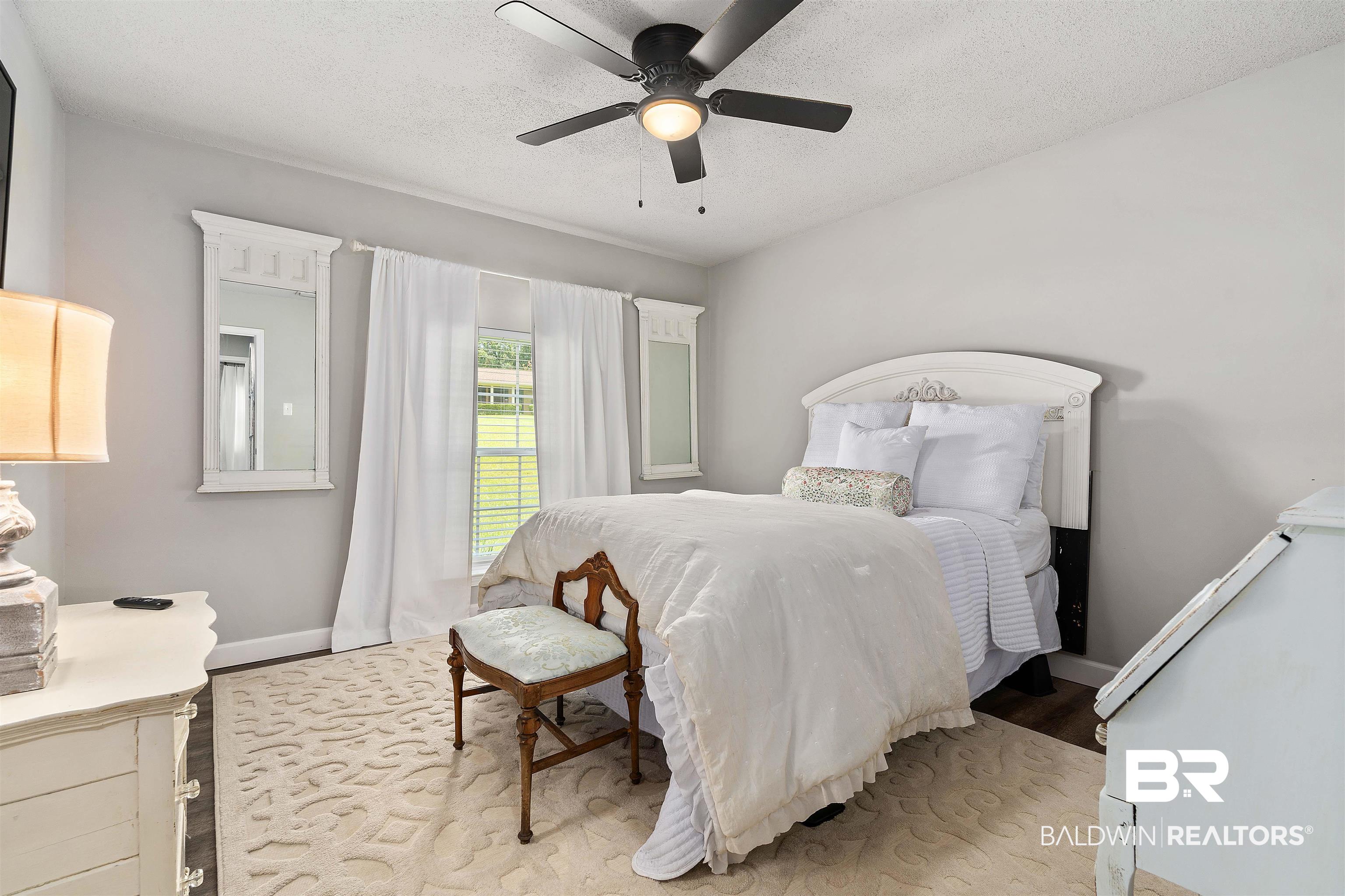 4682 Opal Drive Mobile, AL 36619 - Photo 19 of 27 Bedroom with ceiling fan and wood-type flooring