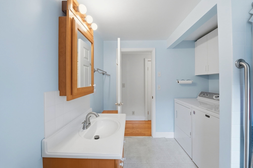 58 Colburn Road Charlton, MA 01507 - Photo 17 of 34 a bathroom with a sink a mirror and a window