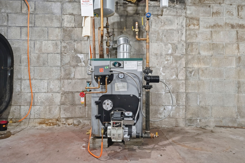 58 Colburn Road Charlton, MA 01507 - Photo 24 of 34 a bathroom with a sink a mirror and shower