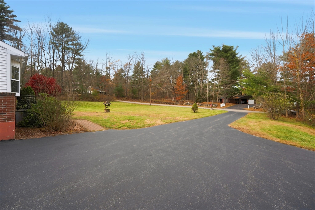 58 Colburn Road Charlton, MA 01507 - Photo 34 of 34 a view of a swimming pool and trees in the background