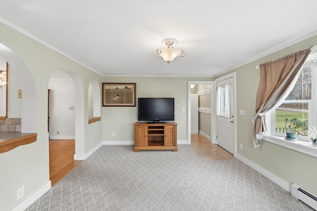 58 Colburn Road Charlton, MA 01507 - Photo 6 of 34 a view of a livingroom with furniture and a flat screen tv
