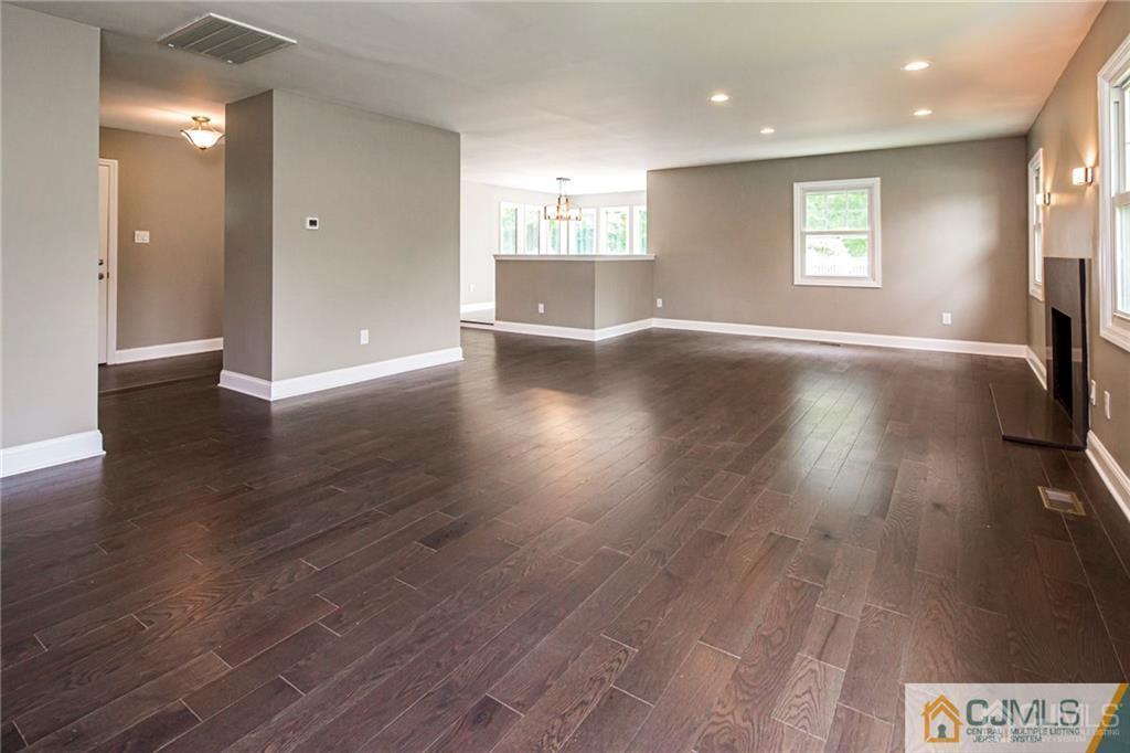 9 Edgewood Road Old Bridge, NJ 07747 - Photo 11 of 35 an empty room with wooden floor and windows