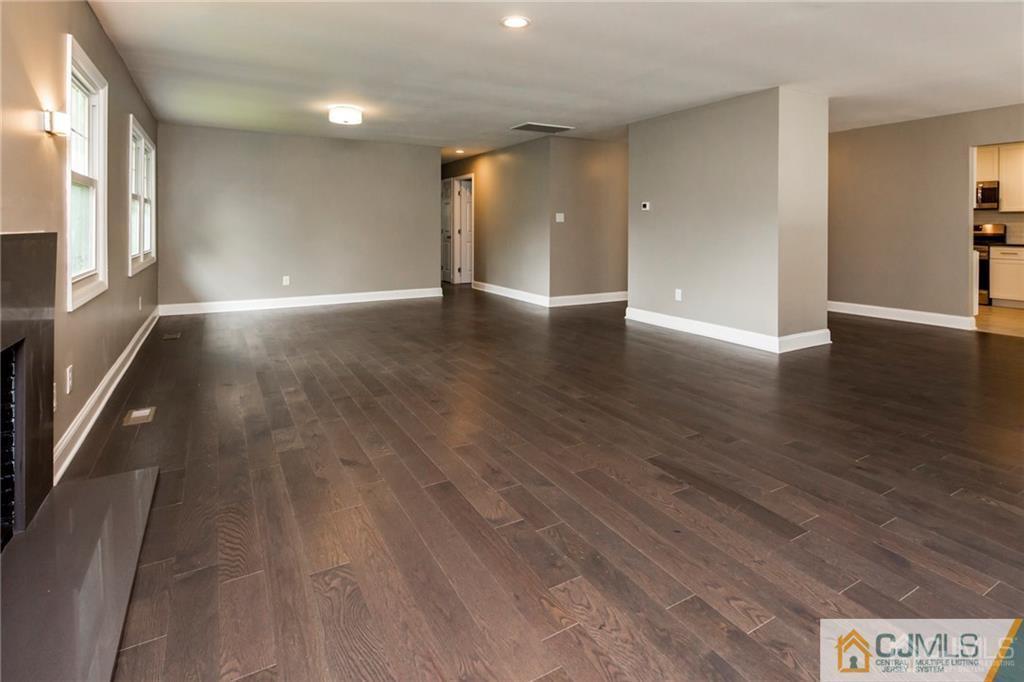 9 Edgewood Road Old Bridge, NJ 07747 - Photo 12 of 35 a view of an empty room with wooden floor and a window