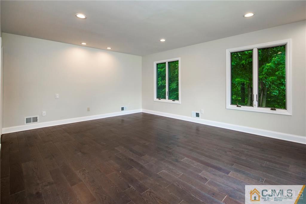 9 Edgewood Road Old Bridge, NJ 07747 - Photo 25 of 35 an empty room with wooden floor and windows
