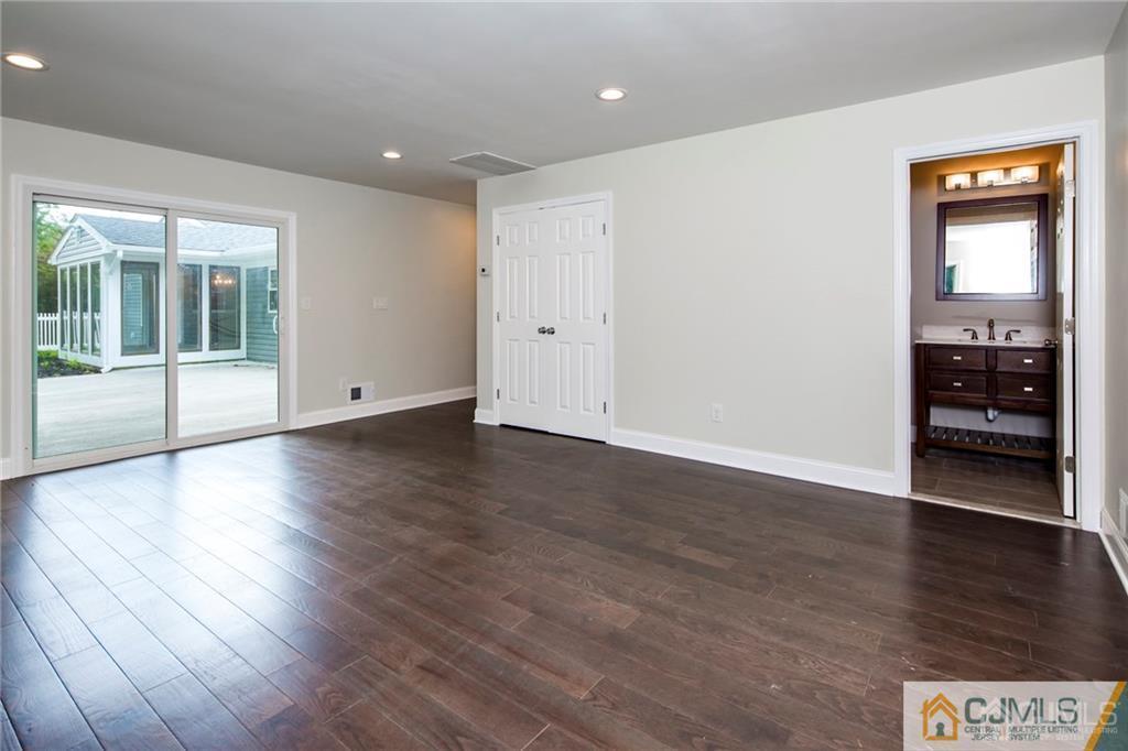 9 Edgewood Road Old Bridge, NJ 07747 - Photo 26 of 35 a view of an empty room with wooden floor and a window