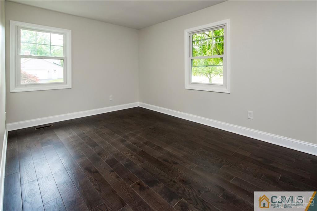 9 Edgewood Road Old Bridge, NJ 07747 - Photo 29 of 35 a view of an empty room with wooden floor and a window