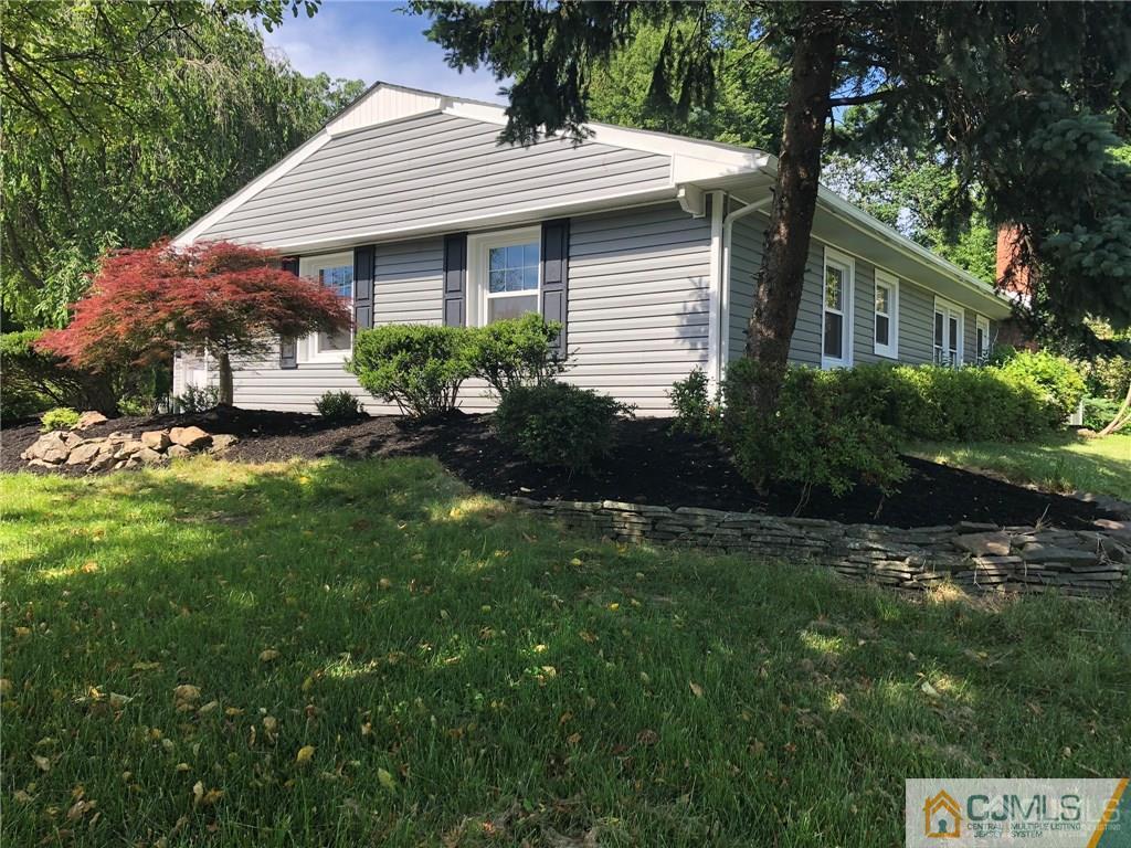 9 Edgewood Road Old Bridge, NJ 07747 - Photo 3 of 35 a front view of a house with garden