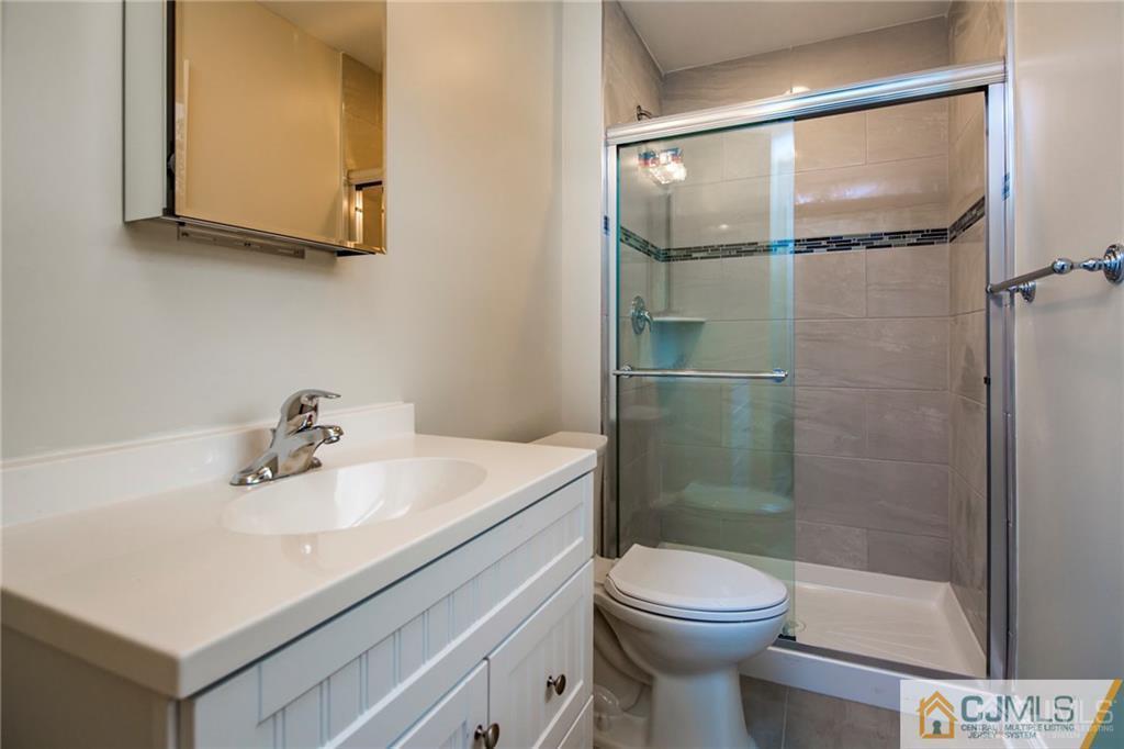 9 Edgewood Road Old Bridge, NJ 07747 - Photo 31 of 35 a bathroom with a sink toilet and shower