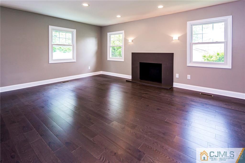 9 Edgewood Road Old Bridge, NJ 07747 - Photo 10 of 35 a view of an empty room with wooden floor and a window