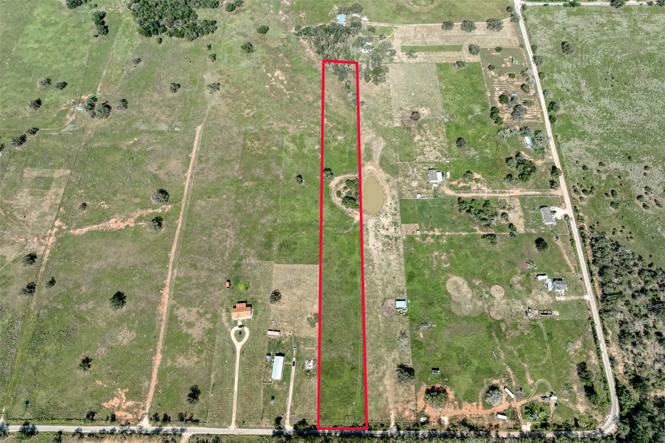 5309 Tenney Creek Road Luling, TX 78648 - Photo 23 of 23 A long, verdant parcel of land awaits your vision.