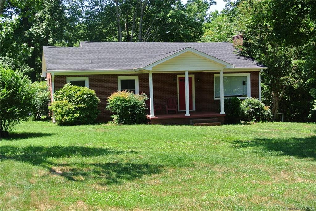 553 Chimney Rock Road Rutherfordton, NC 28139 - Photo 3 of 12 a front view of a house with a garden