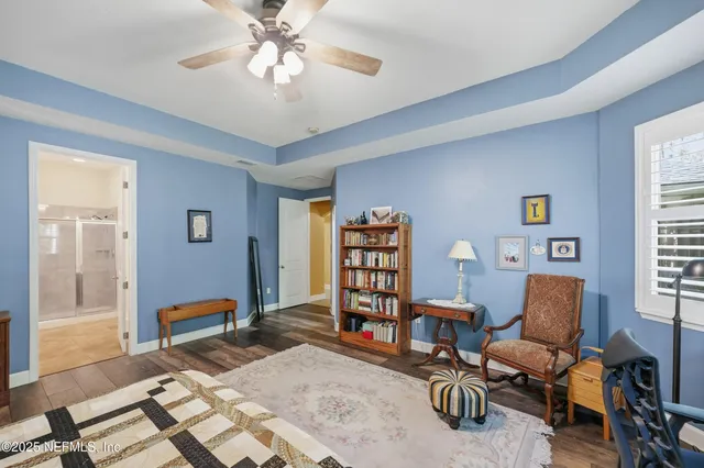 a bathroom with a granite countertop sink mirror bathtub and shower